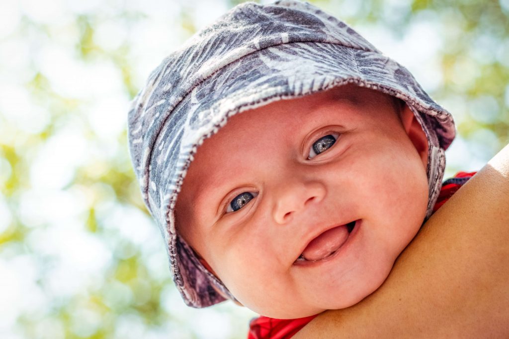 a 6 months old baby smiling