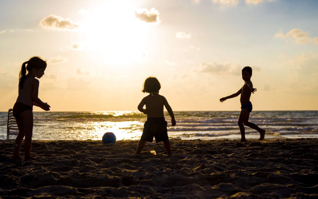 kids playing on the beach